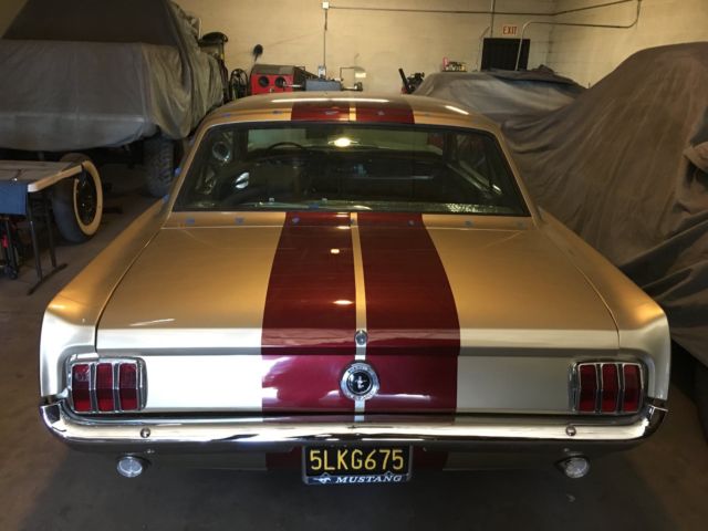 1965 Ford Mustang (champagne & burgundy pearl/Black)